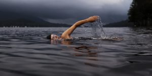 Woman swimming in open water