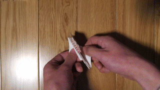 Animation of a person demonstrating the Miura fold on a piece of paper