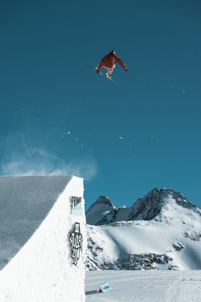 Snowboarder getting big air off a jump