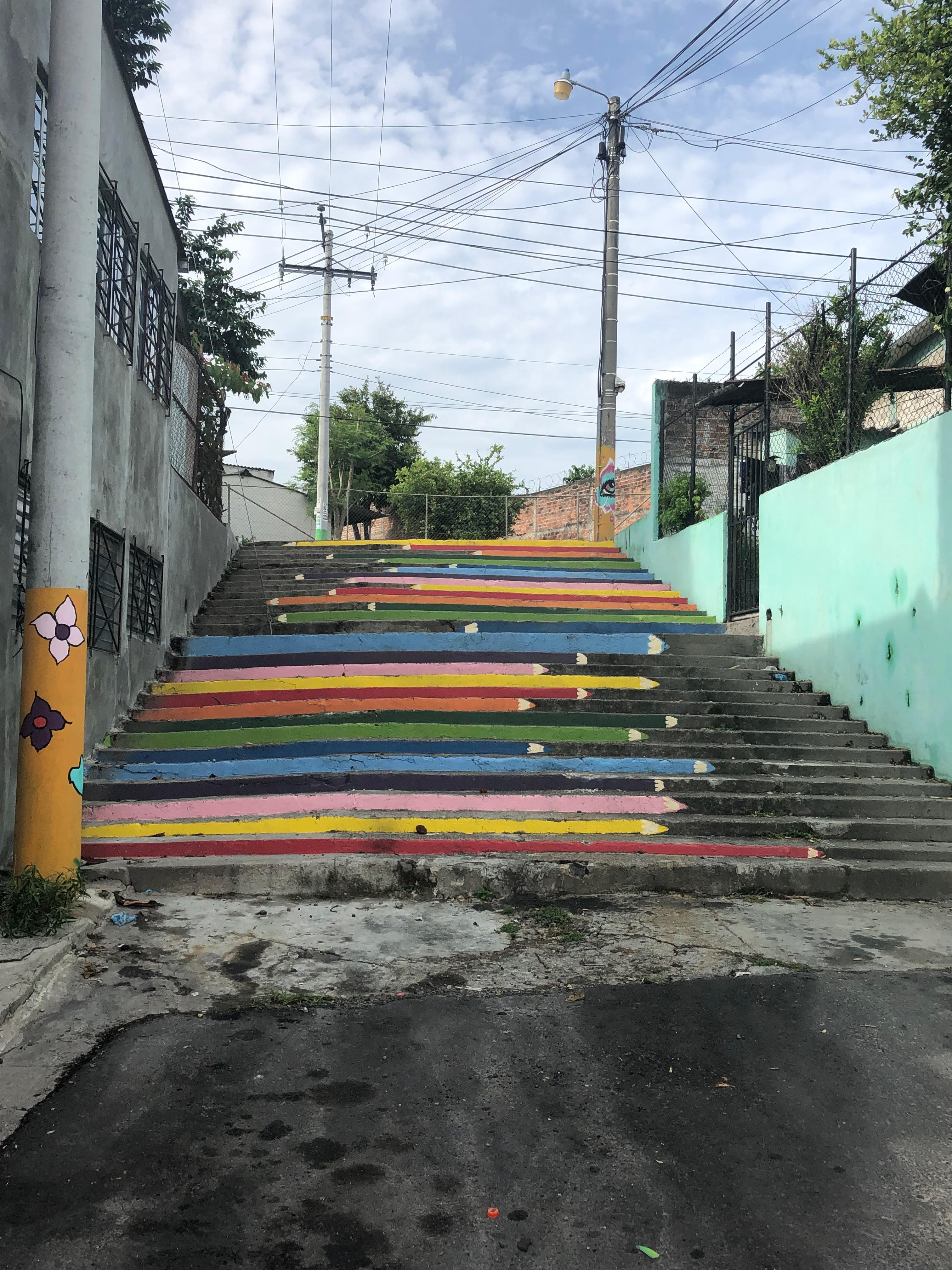 A brightly painted mural of crayons on a staircase
