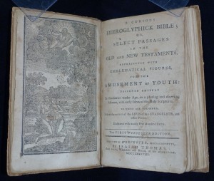 Title page and frontispiece of A curious hieroglyphick Bible (Worcester : Printed at Worcester, Massachusetts, by Isaiah Thomas and sold ... at his bookstore, 1788).