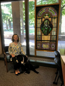 Photo of service dog named Snowbird and student