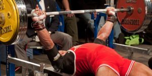 Man about to perform the bench press in competition.