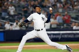 Aroldis Chapman in the middle of his pitching motion.