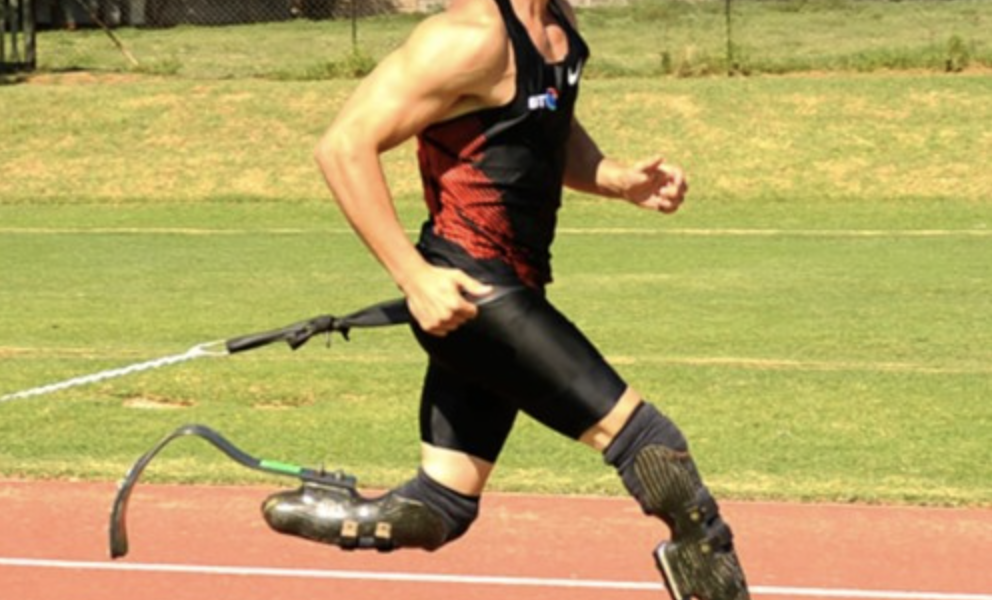 Image of a man with prosthetic limbs running