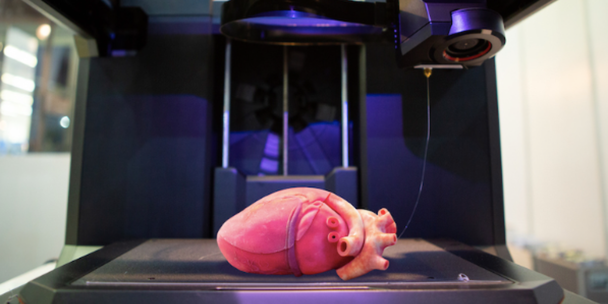 Heart sitting on top of a 3D printer as a finished product.