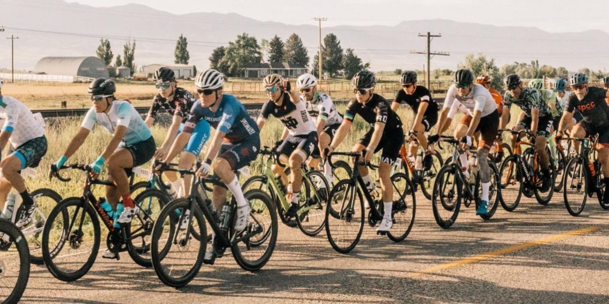 cycling peloton riding down road in Utah
