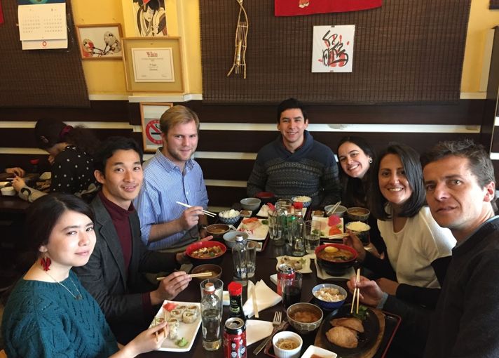 MGA students and representatives from Enseña Chile share Japanese cuisine at a restaurant in Chile.