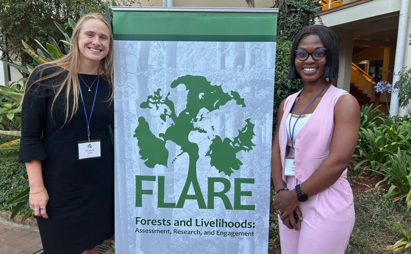 photo of lizzie stifel and MGA student standing next to FLARE banner