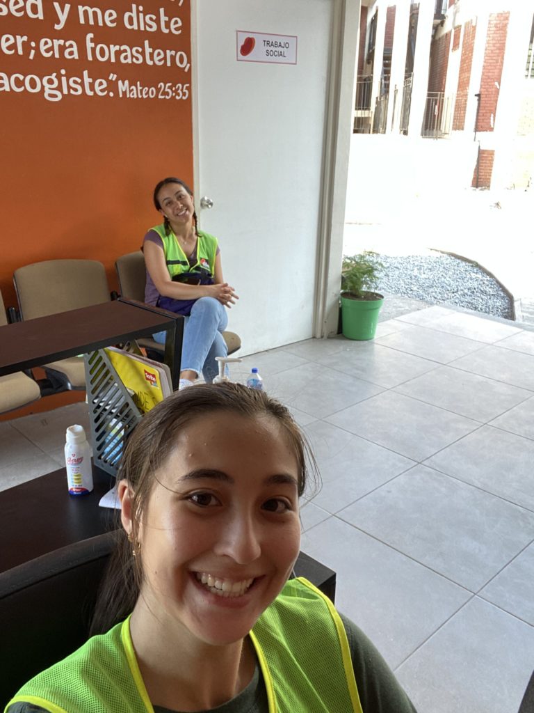 Me and Kat (another ND student) sitting at the front desk at Casa Monarca (shelter in MX). 