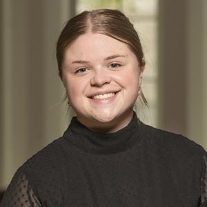 Portrait of Genevieve Cicchiello, Spring Executive Vice President of Notre Dame SWE, smiling and wearing a black turtleneck.